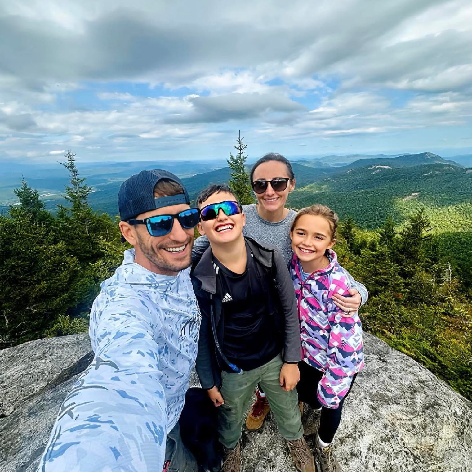 Jay Hicks with wife Megan and kids Lliam and Paitynn on an Adirondack summit